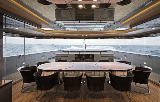winter garden with dining table aboard superyacht ‘Silver Fast’ 