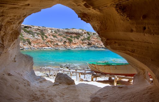 Rocky cove in Ibiza, looking out to the Mediterranean sea and white sand