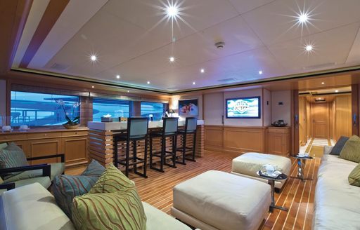 upper lounge with sofas and bar on board superyacht HANA