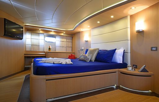 full-beam master suite with light wood joinery on board luxury yacht Silver Mama