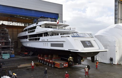 aft view of motor yacht KD being transported out of shipyard before her launch