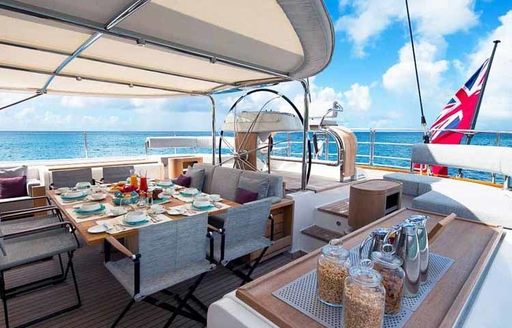 large cockpit on board charter yacht ‘State of Grace’ set up for breakfast