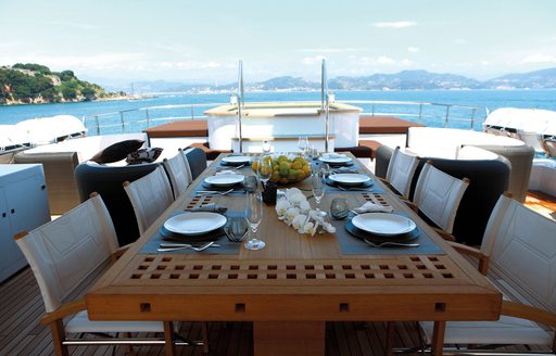 dining table on zaliv iii with view of jacuzzi pool in background