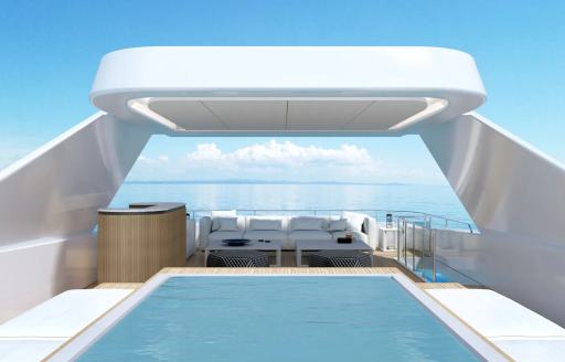A pool-Jacuzzi on the sun deck of charter yacht MAESTRO with a wetbar and seating aft