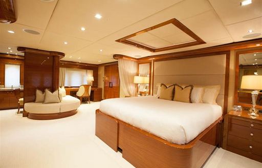 Cream furnishings in master suite of motor yacht Aspen Alternative