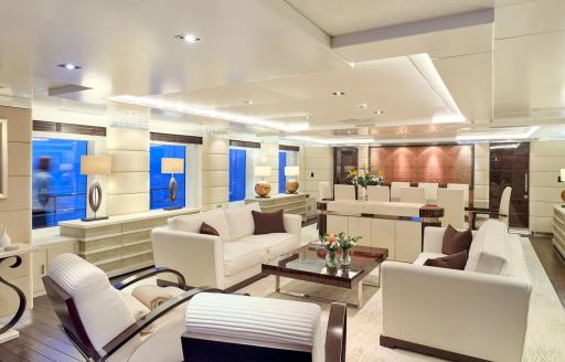 Overview of the main salon onboard charter yacht TIMBUKTU, spacious lounge area with plush white seating