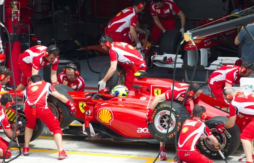 Overview of crew in action in the Ferrari pits at the Monaco Grand Prix