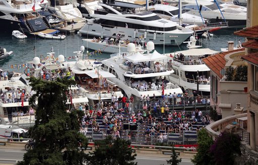 superyachts by the racetrack at the monaco grand prix