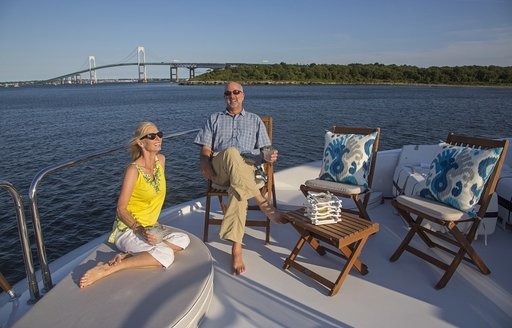 charter guests relax on the sundeck aboard charter yacht ‘Gale Winds’ 
