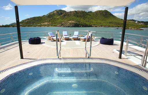 Jacuzzi and helipad on sundeck of Northern Star charter yacht