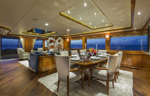 The formal dining inside luxury yacht TEMPTATION
