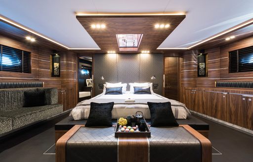 Master suite with warm leather and skylight on board charter yacht Rox Star