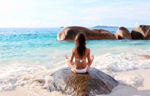Meditation on a beach in Seychelles
