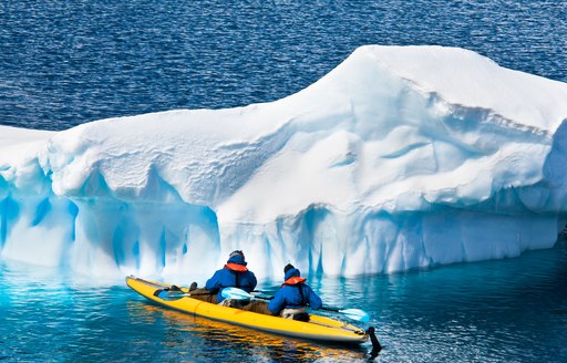 kayaking in antarctica, alongside glacier 