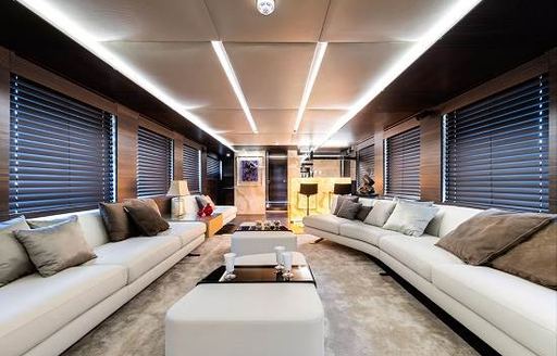 The cool and contemporary white furnishings and silver carpet on board superyacht SHADOW