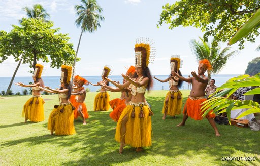 Polynesian women perform traditional dance in Tahiti Papeete. 