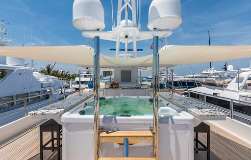 Jacuzzi with swim-up bar on sundeck of luxury yacht PRAXIS 