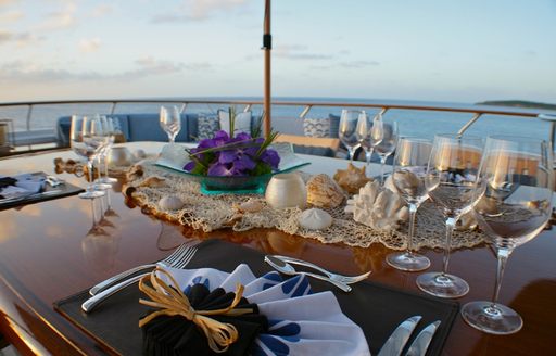 luxury motor yacht LADY J al fresco dining table offering amazing views of st barts