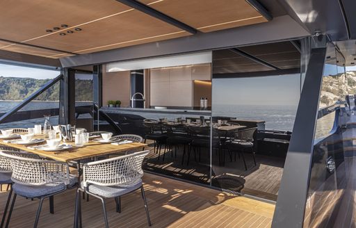 Covered dining areas on motor yacht HAZE looking inside