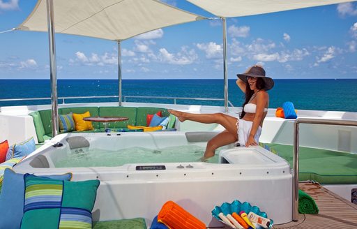 luxury motor yacht RHINO deck Jacuzzi surrounded by comfy seating areas