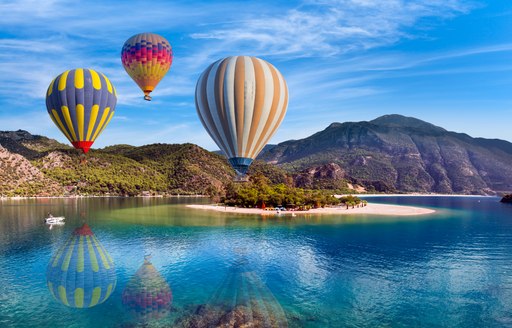 Hot air balloon flying over spectacular oludeniz lagoon in Turkey