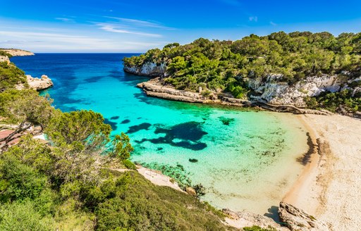 Secluded bay in Corsica with white sand and blue water