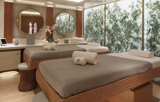 Massage beds in the spa area onboard, decorated with bamboo wall feature 