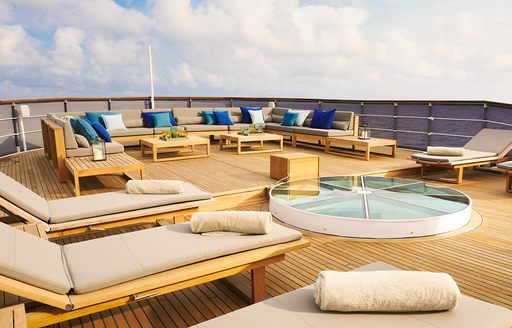 sundeck with a line-up of sun loungers on board classic yacht MENORCA 