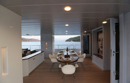 luxury yacht only now dining table with seascape views beyond