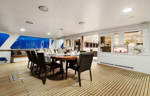 aft deck alfresco dining arrangement on board charter yacht