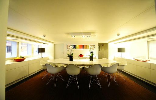 formal dining area in main salon of charter yacht BERZINC 