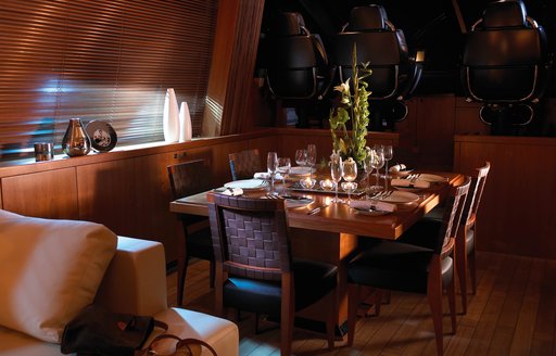 luxe dining area in main salon of charter yacht ‘Casino Royale’ 