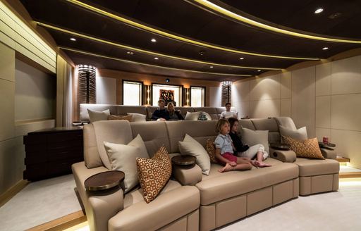 the interior cinema of a charter yacht