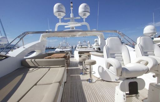 Sundeck on luxury charter yacht Mi Alma, with sunpads and wet bar