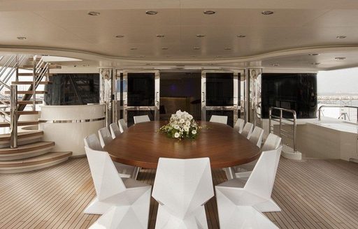 The central alfresco dining space on board motor yacht Light Holic