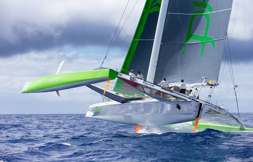 A foiling race boat trying to keep control at Les Voiles de St Barth