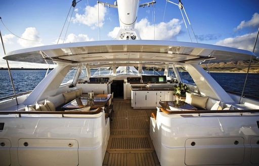 semi-alfresco pilothouse with comfortable dining options on board charter yacht ETHEREAL 