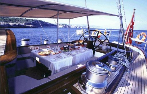 alfresco dining set up in cockpit of luxury yacht SHAMOUN 