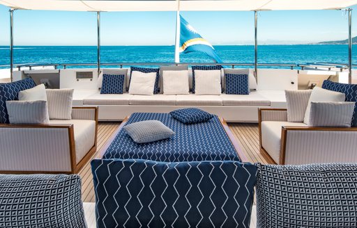 Large sofa with sea view behind on superyacht RARITY