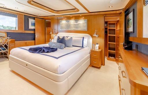Master cabin onboard charter yacht Far Niente, central berth with a large window to port