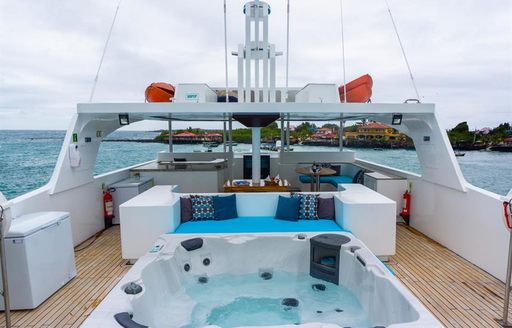 Sundeck on motor yacht Grand Daphne with Jacuzzi in foreground