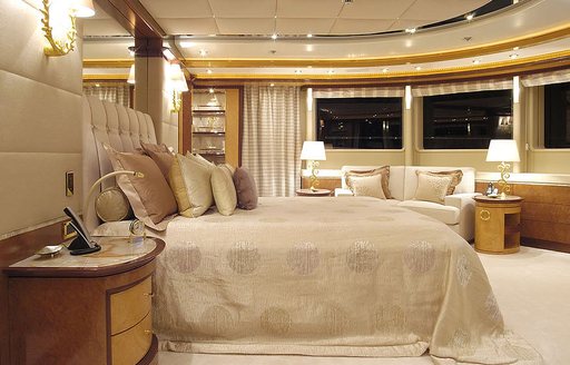 Master cabin onboard motor yacht LADY MAJA I, central berth facing starboard with large windows surrounding 