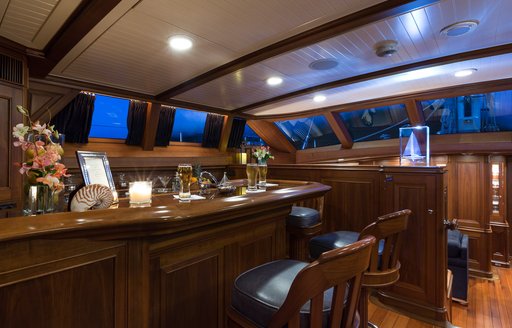 bar with stools in upper salon of luxury yacht MARAE 