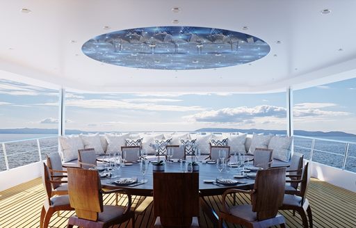 the main alfresco dining area located on the main aft deck of charter yacht Aurum sky