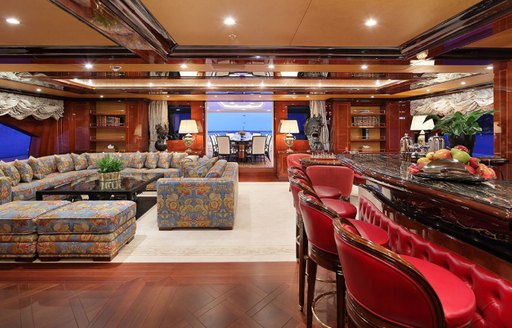 padded bar and large seating area in the skylounge of charter yacht ULYSSES 
