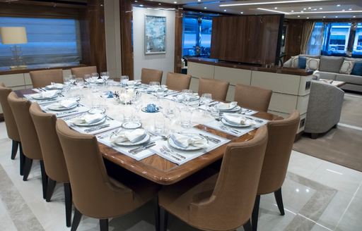 formal dining in the main salon of superyacht ‘Princess AVK’ 