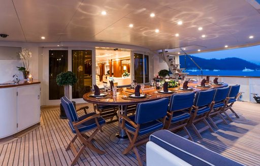 Alfresco dining area on the aft deck onboard charter yacht OLYMPUS