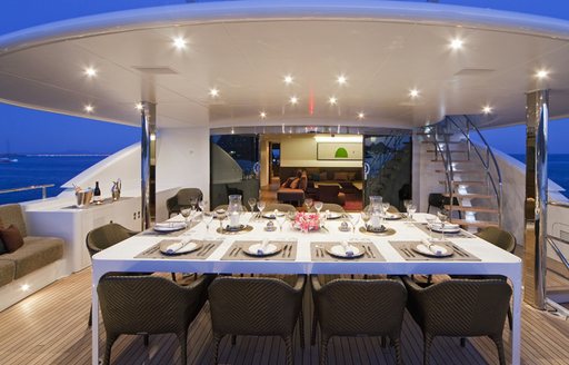 vast alfresco dining area on upper deck aft of luxury yacht JEMS