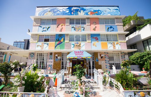 a  large and palacial house painted in pastel colours acts as a statement at miami beach's art basel