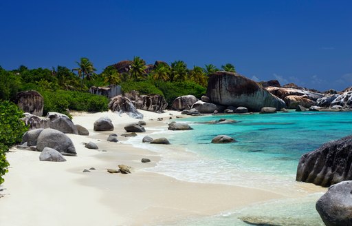 a beach in the British Virgin Islands, where superyacht ‘Le Reve’ cruises on luxury yacht charters 
